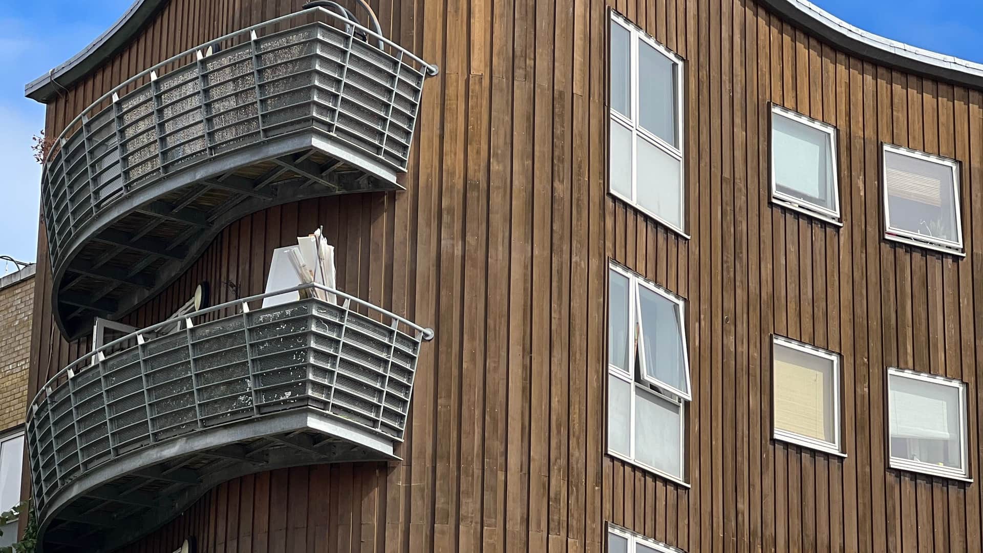 Low-rise apartment block with balconies, illustrative