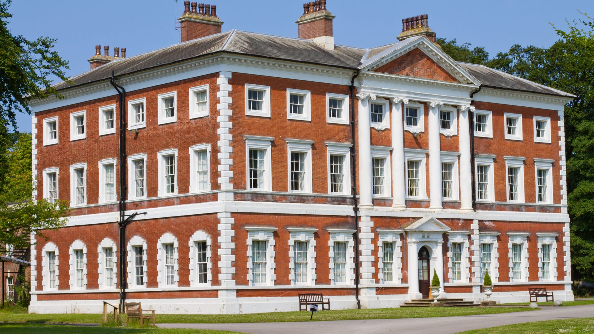 Georgian brick country house with lawns, illustrative