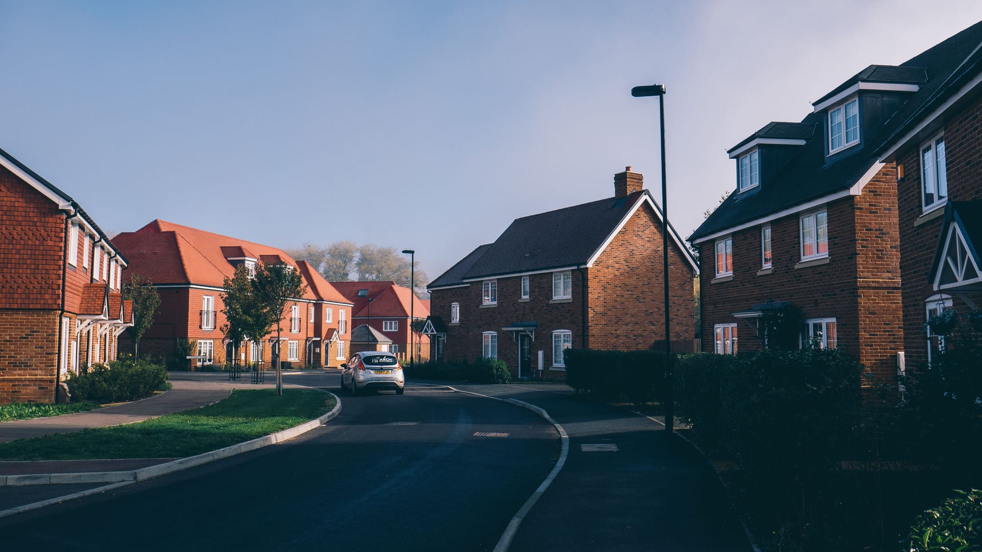 New-build detached brick houses, illustrative
