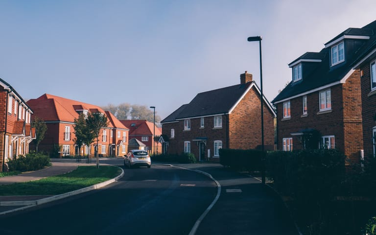 New-build detached brick houses, illustrative