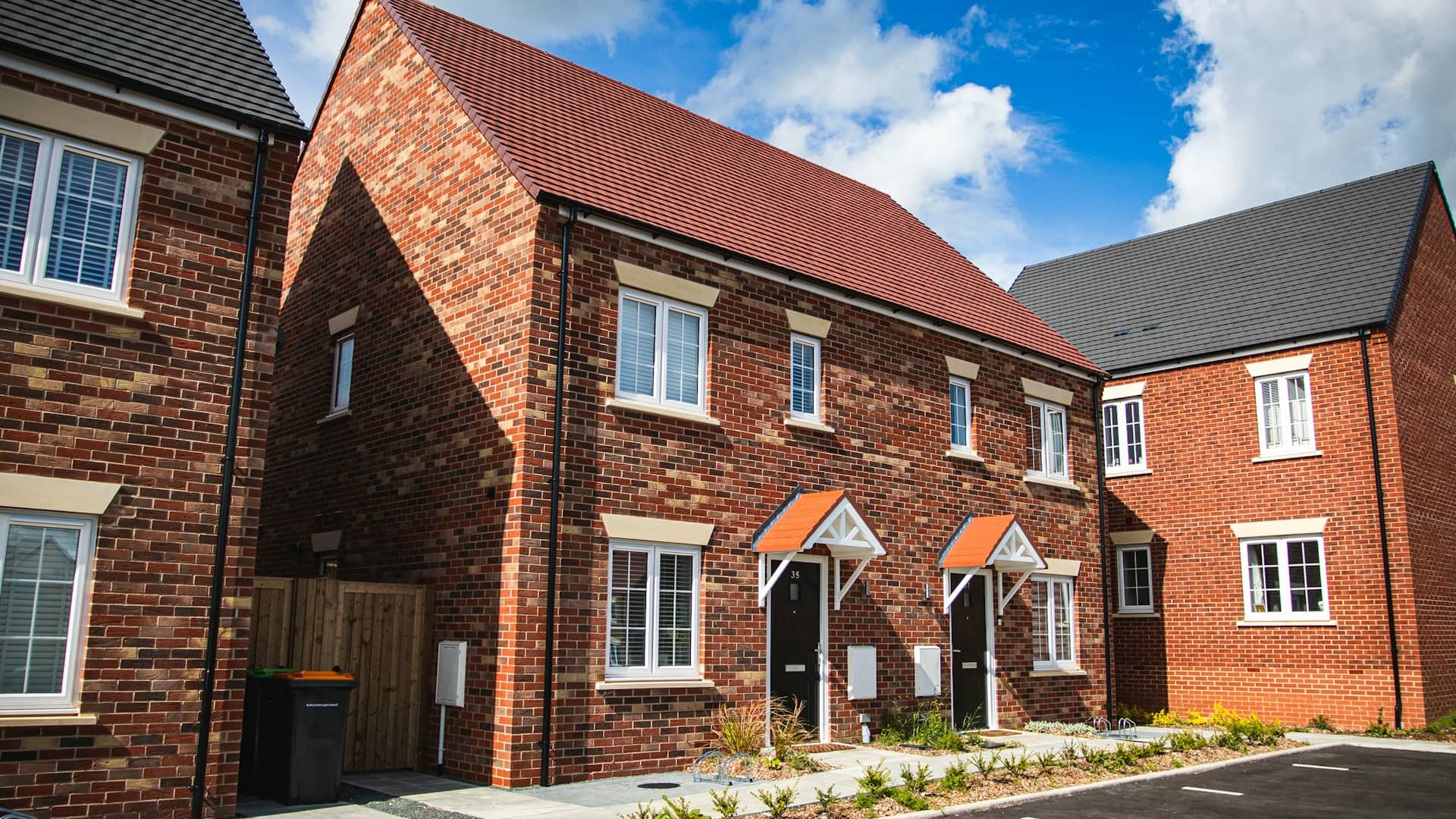 New-build brick homes on an estate, illustrative